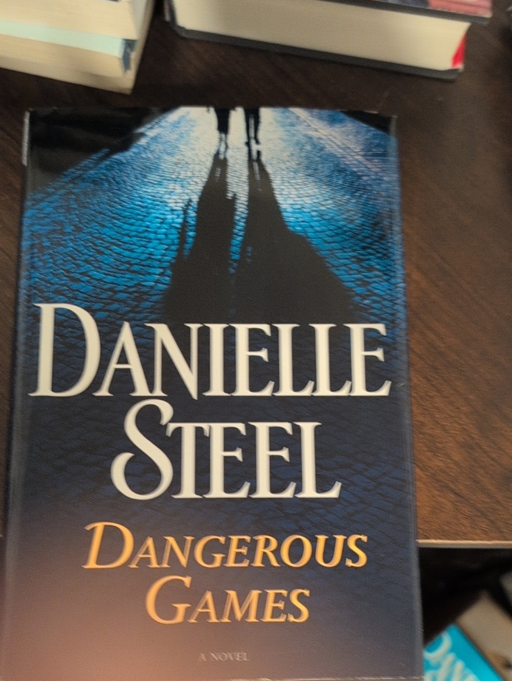 Dangerous Games – Navy Blue Hardcover Novel